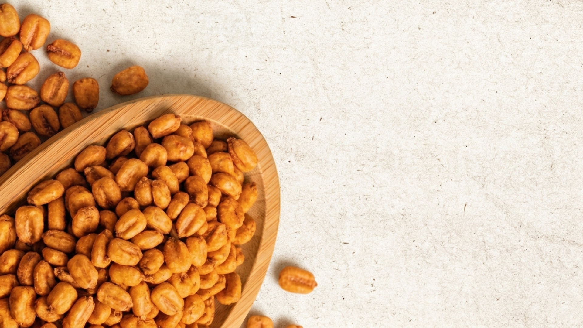 Bulk production of flavored corn snacks in a modern factory setting.